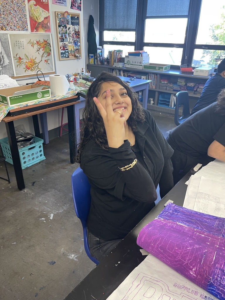 students in art class being creative making their pop art bags