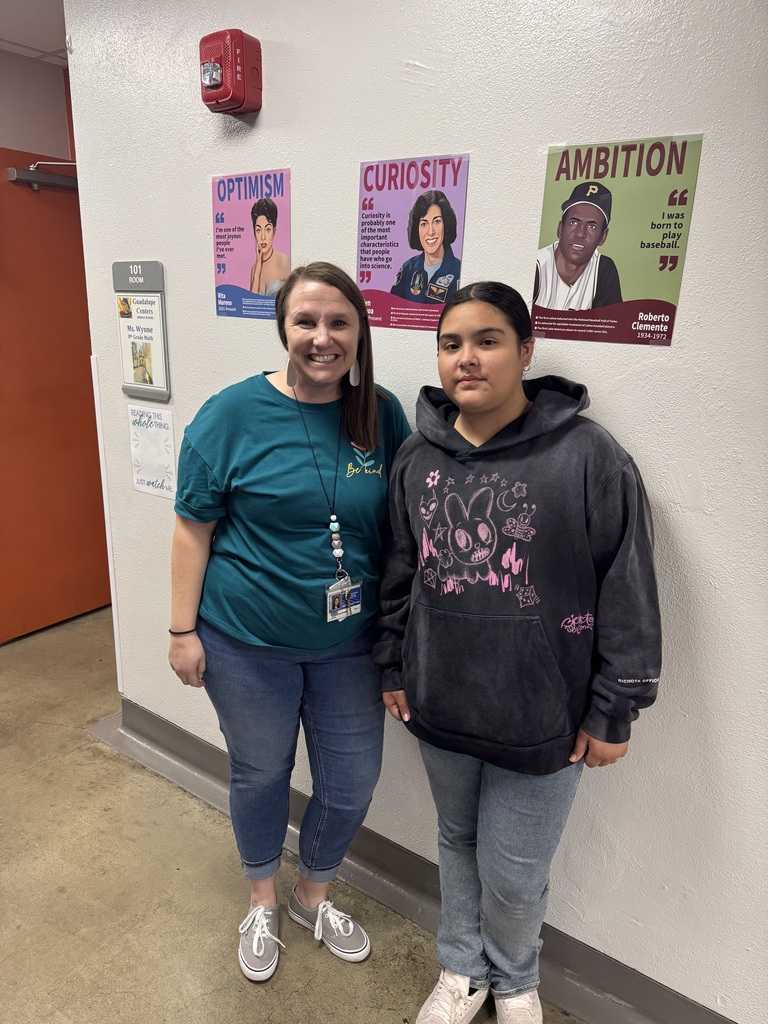 teacher and student posing for a picture