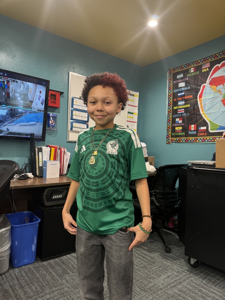 student wearing a green jersey