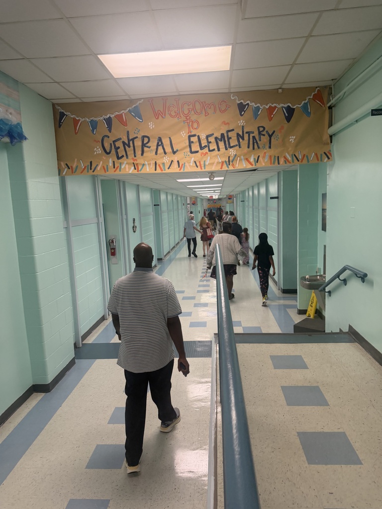 Students and staff members walking down the hall for our Open House