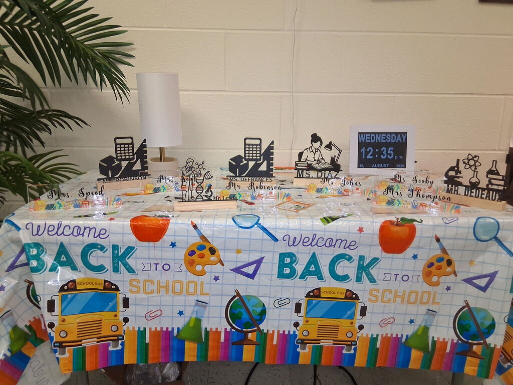 A table in the front office that has all of the custom pieces from Covenant Christian Bookstore for our novice teachers