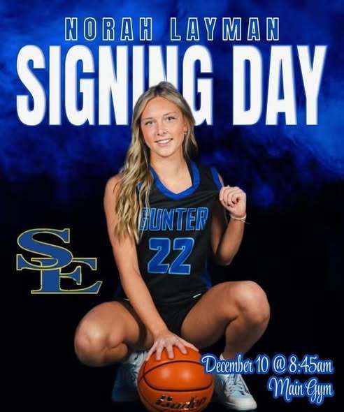 Norah Layman signing with a college to play basketball.
