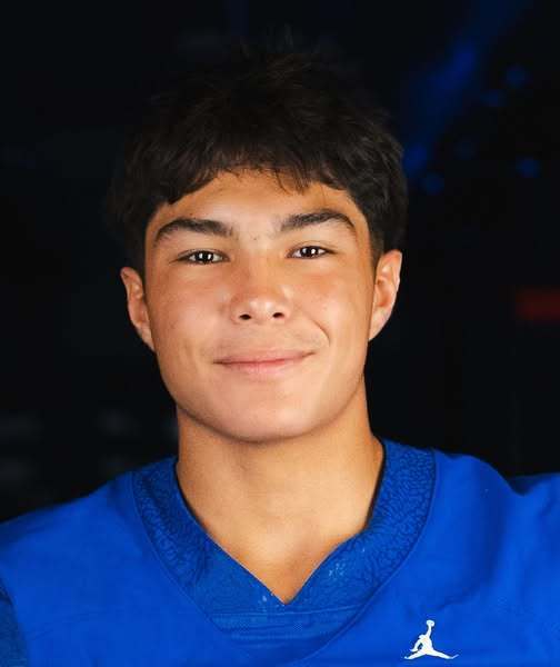 Football student wearing a blue jersey.