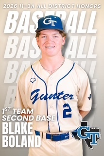 A young male wearing a baseball uniform with "Guinter" and "2" on the jersey. He is smiling and wearing a baseball cap. The background includes text.