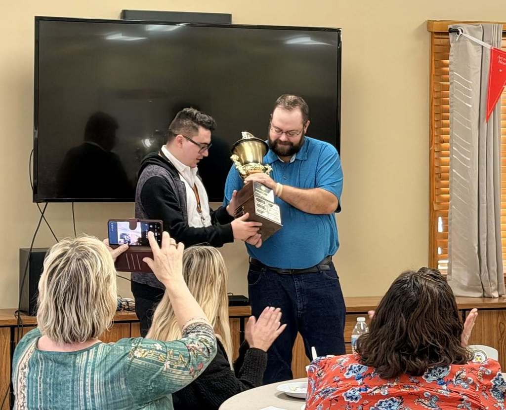 rib eating winners with trophy