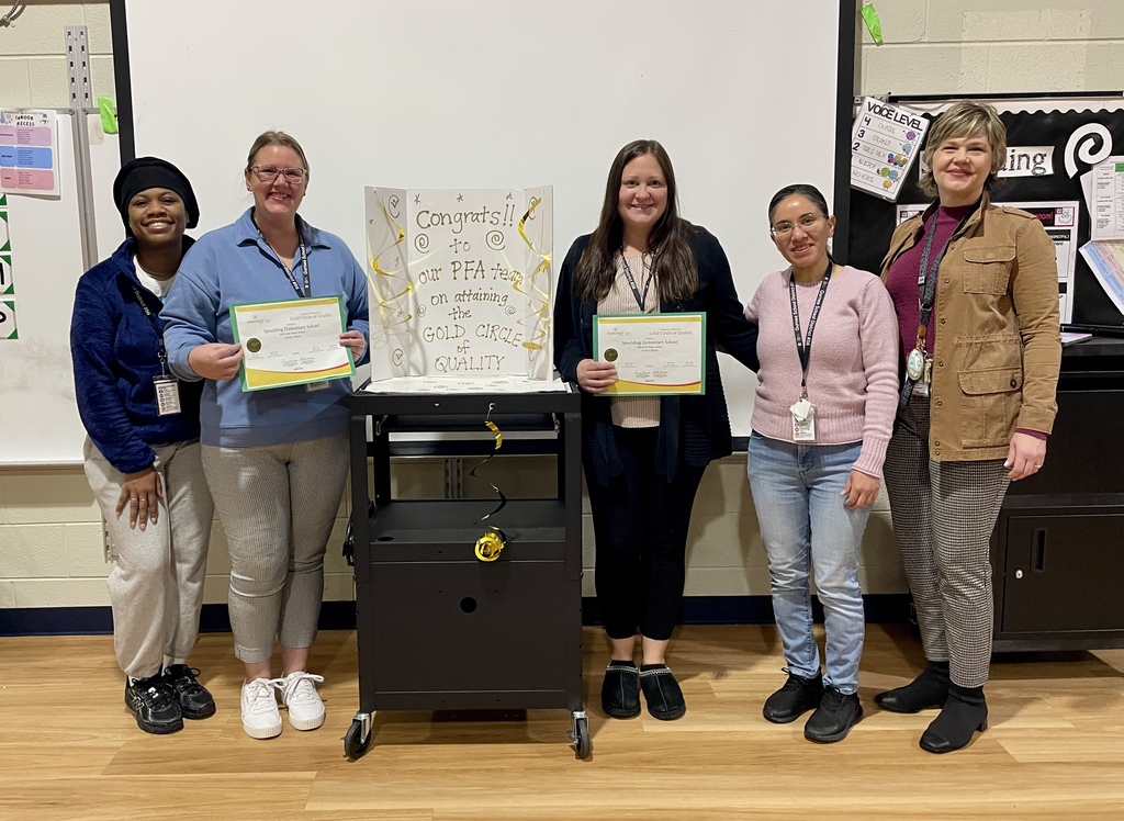 spaulding preschool staff with principal and award