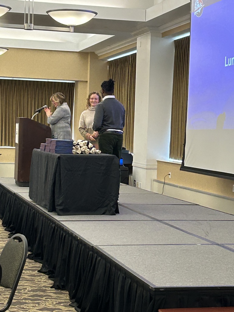 Mrs. Westfall receiving her award.