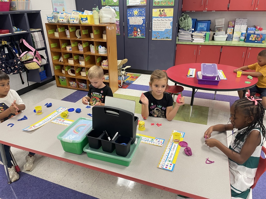 Kindergarten using Play Dough to create letters