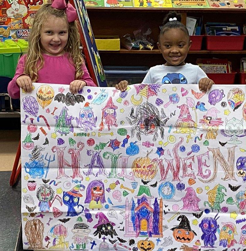 Students Work Together to Complete Halloween Posters