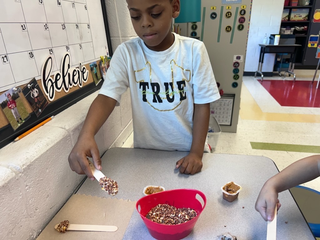 Ms. Snead's first graders make bird feeders