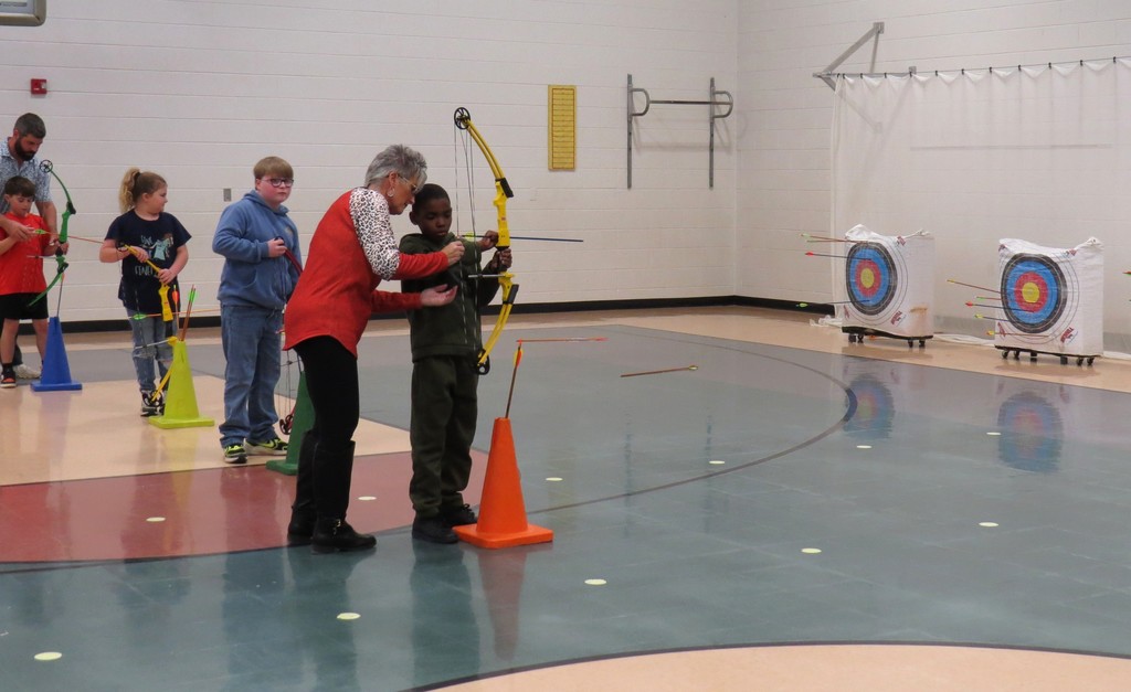 Students Learn Archery Skills in PE Class