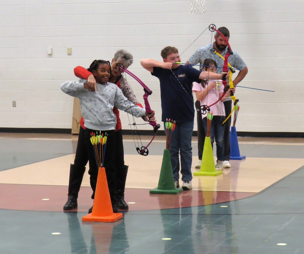 Students Learn Archery Skills in PE Class