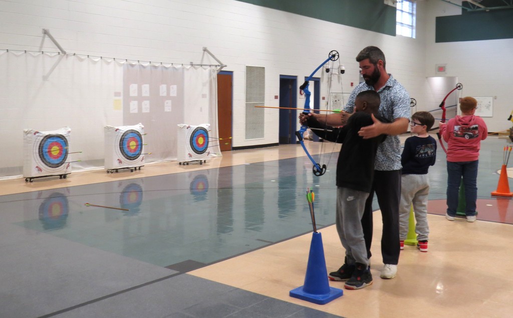 Students Learn Archery Skills in PE Class