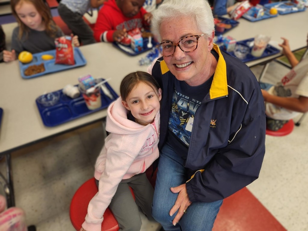 Mrs. Hatz reads to 1st graders in honor of Veterans Day