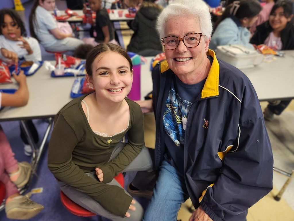 Mrs. Hatz reads to 1st graders in honor of Veterans Day