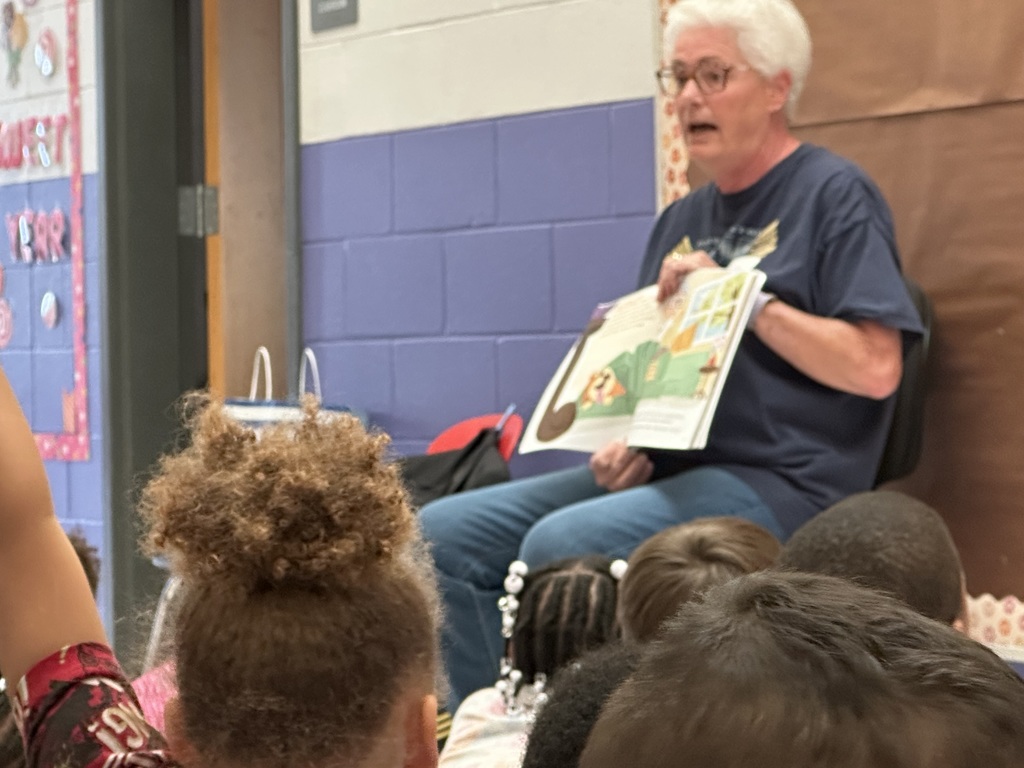 Mrs. Hatz reads to 1st graders in honor of Veterans Day