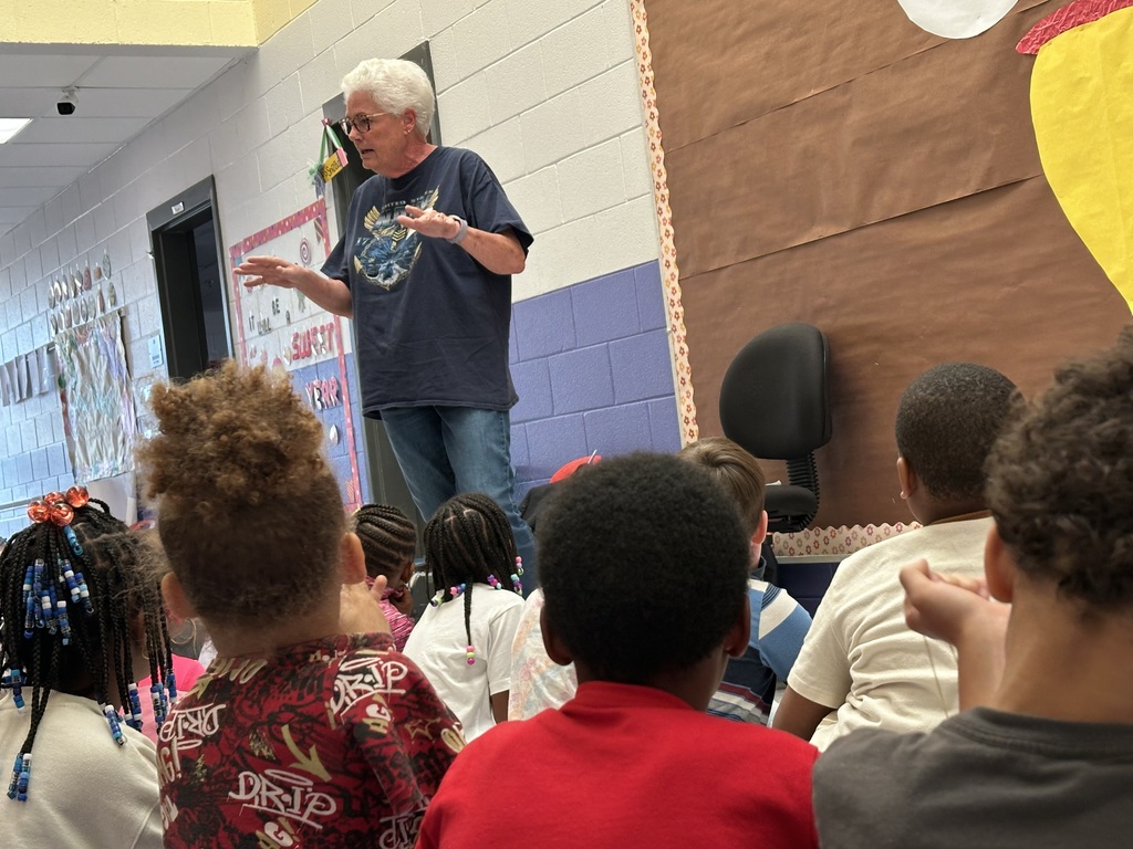 Mrs. Hatz reads to 1st graders in honor of Veterans Day