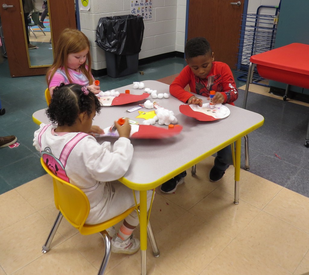 Pre-K Students Create Santa Faces Using Various Shapes 