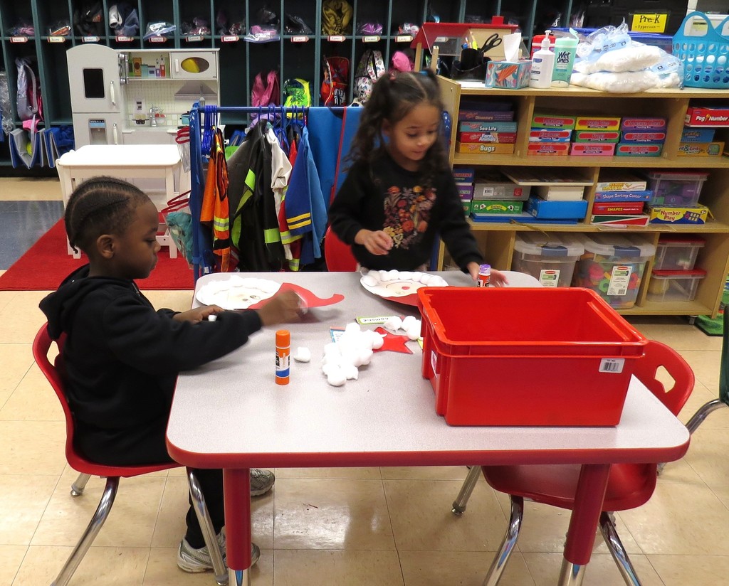 Pre-K Students Create Santa Faces Using Various Shapes 