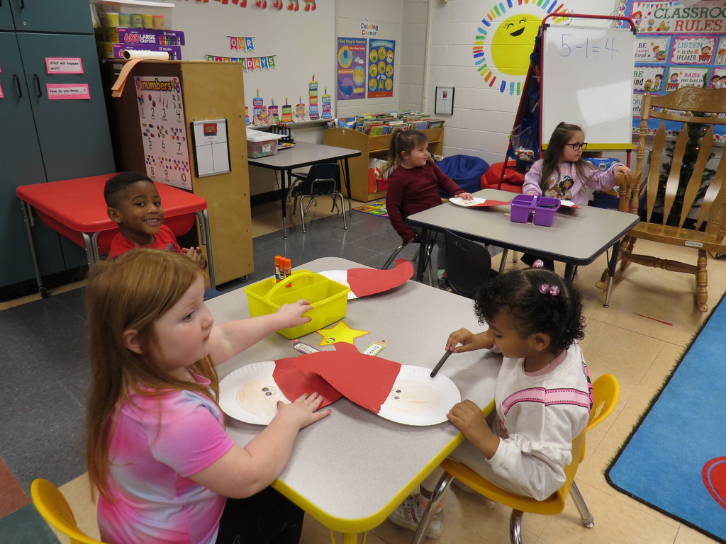 Pre-K Students Create Santa Faces Using Various Shapes 