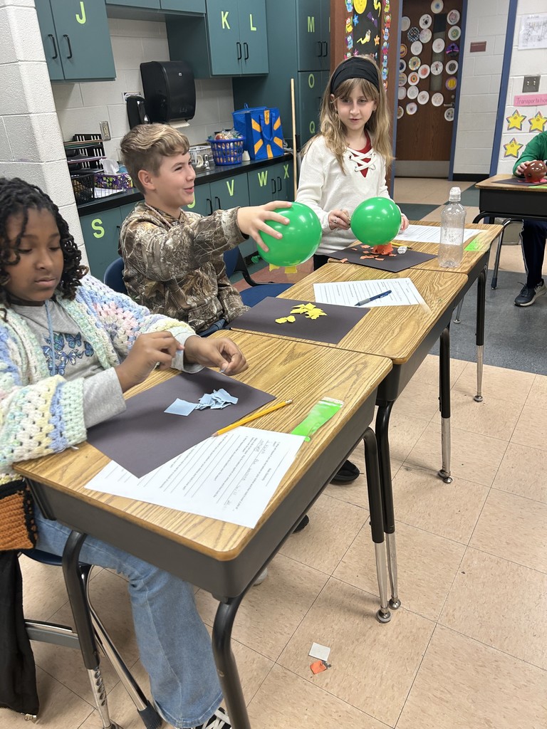 Fifth Graders Investigate Static Electricity During Science Class