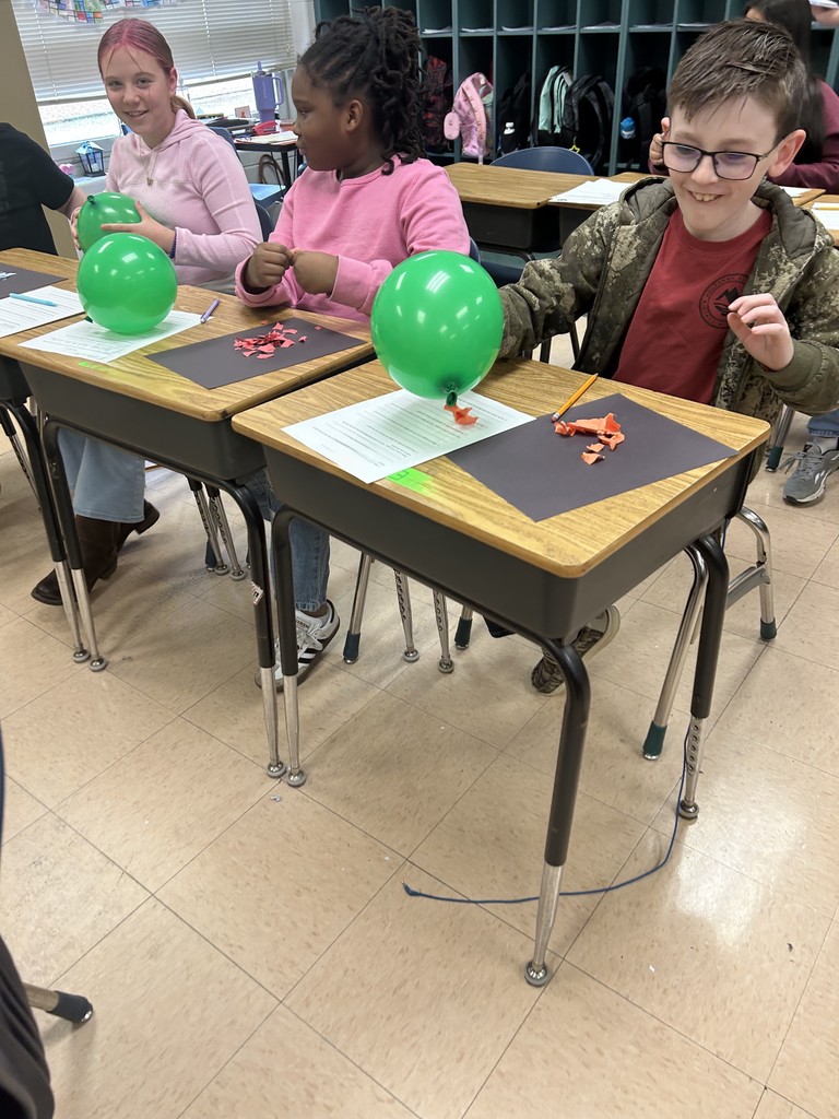 Fifth Graders Investigate Static Electricity During Science Class