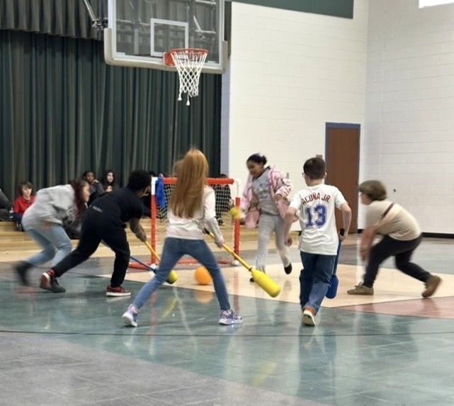 Students Learn Hockey Skills During PE