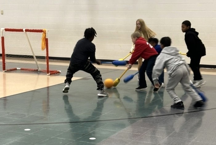 Students Learn Hockey Skills During PE