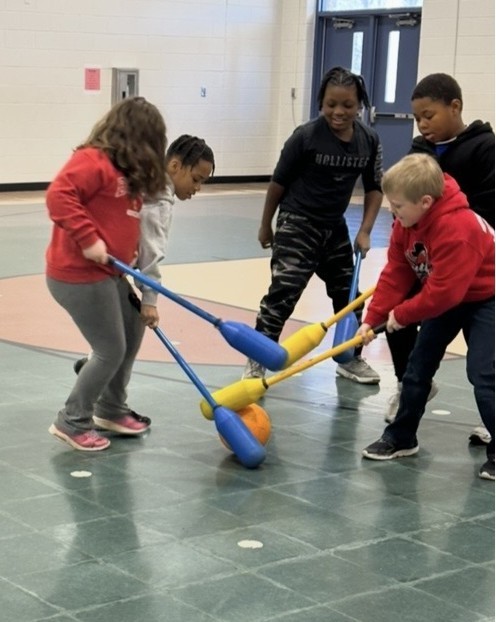 Students Learn Hockey Skills During PE