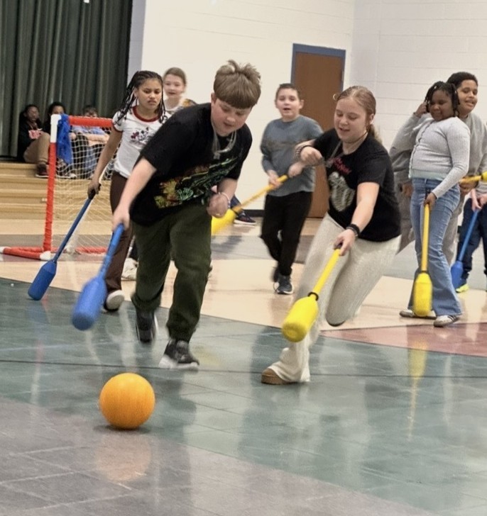Students Learn Hockey Skills During PE