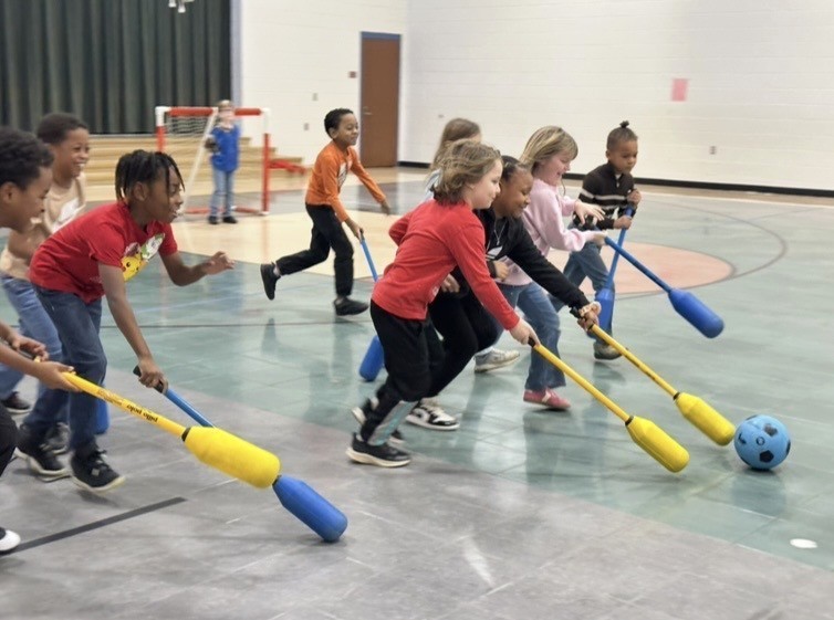 Students Learn Hockey Skills During PE