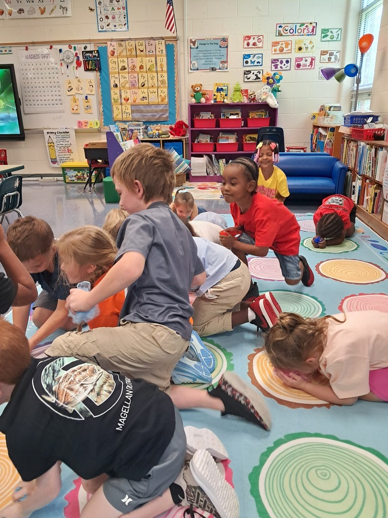 scholars sitting on rug