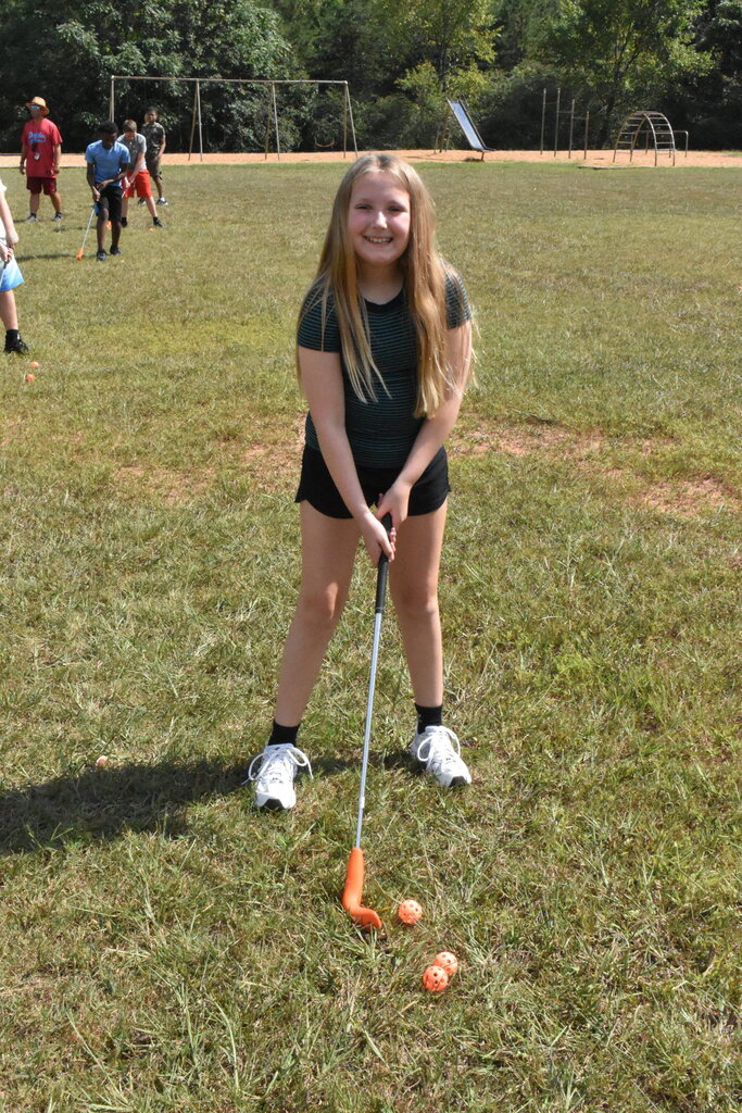 Scholars playing golf