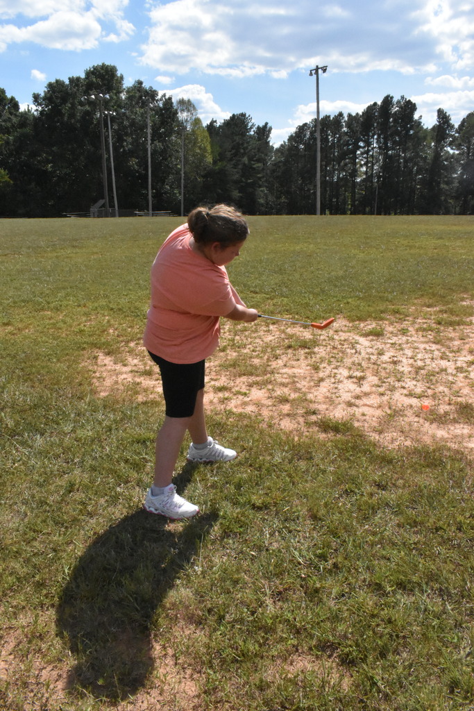 Scholars playing golf