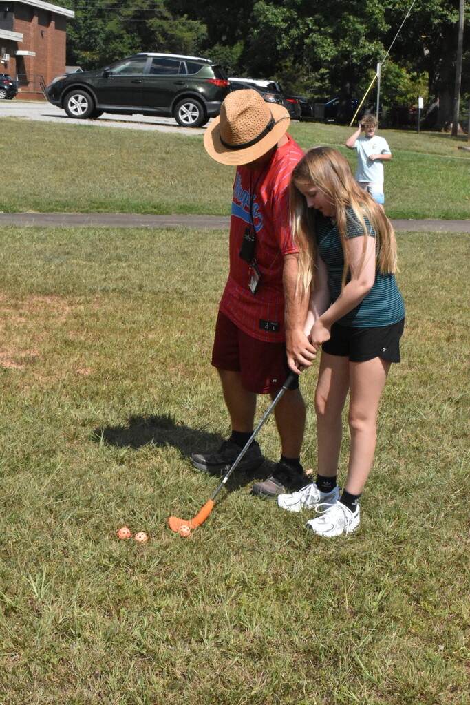 Scholars playing golf