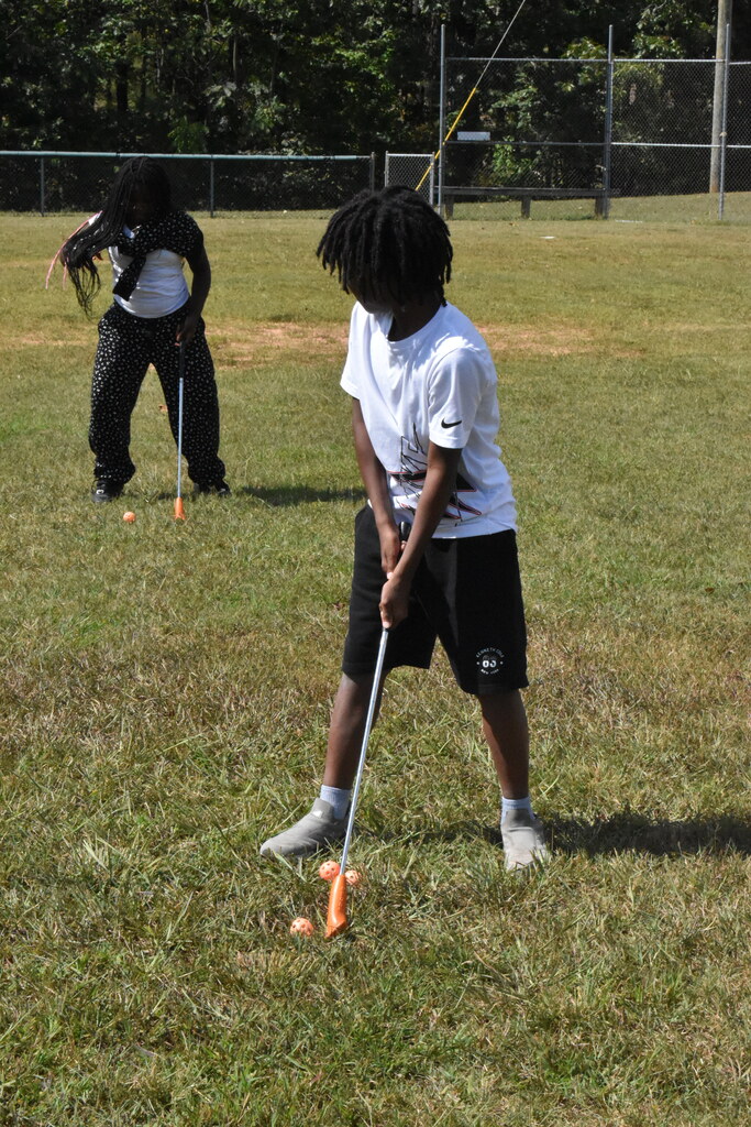 scholars playing golf
