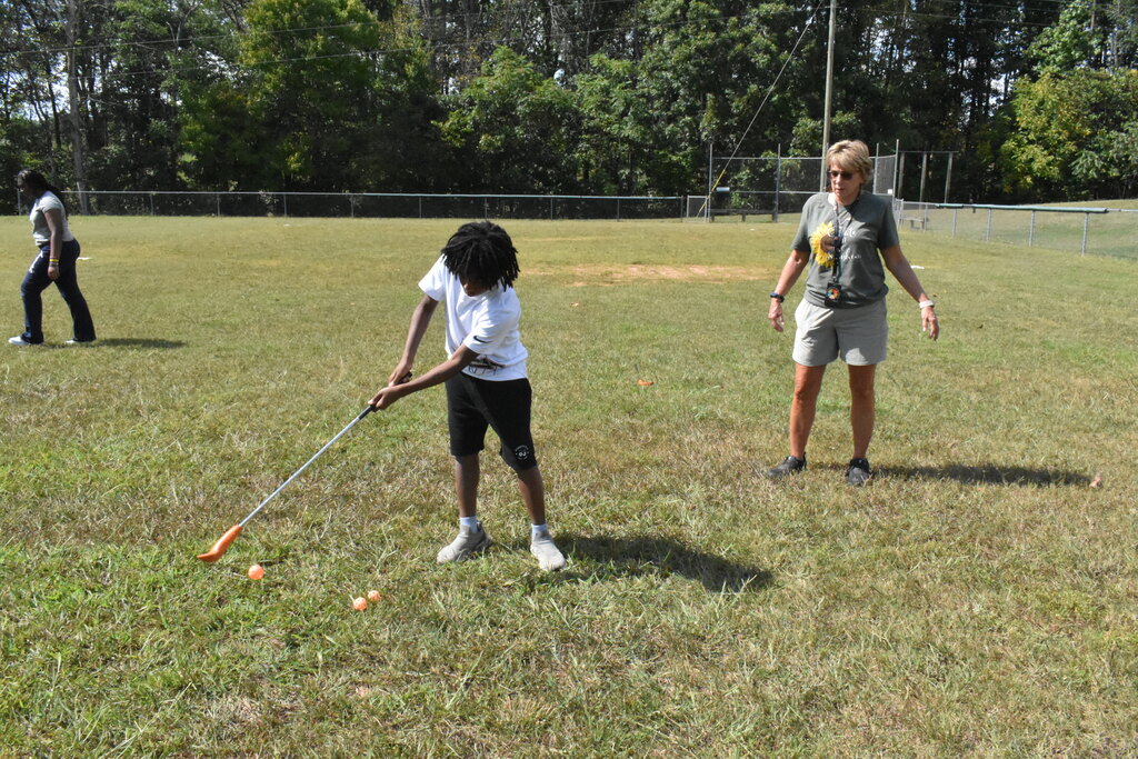 Scholars playing golf