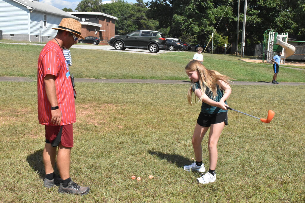 Scholars playing golf