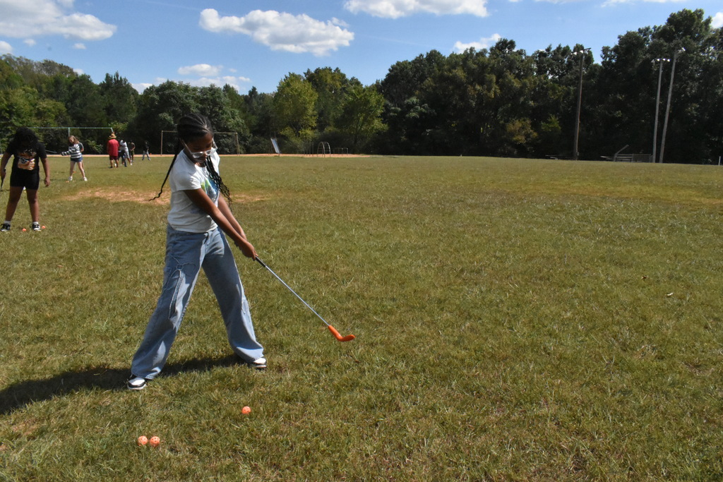 scholars playing golf