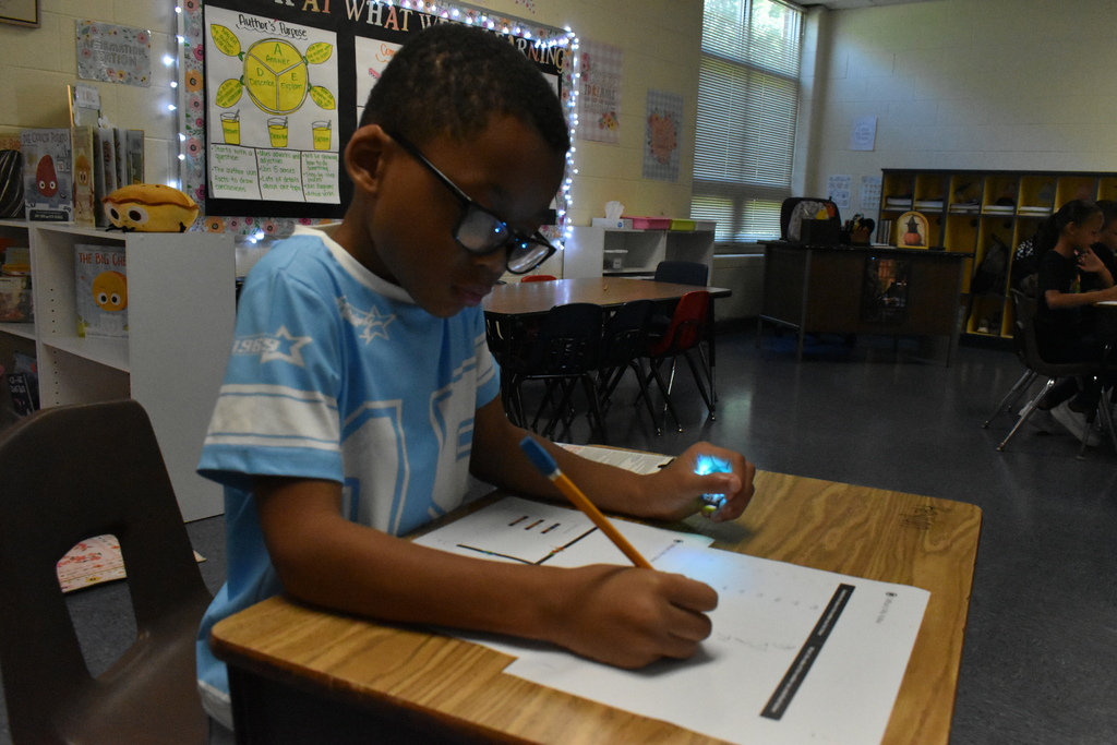 scholars working with ozobots