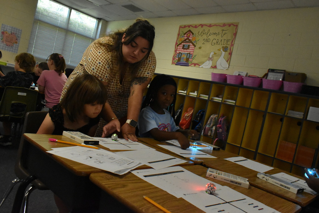 scholars working with ozobots