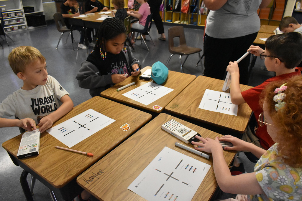 scholars working with ozobots