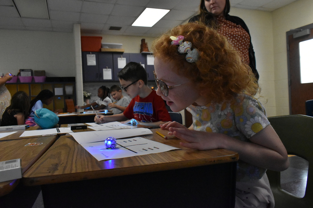 scholars working with ozobots