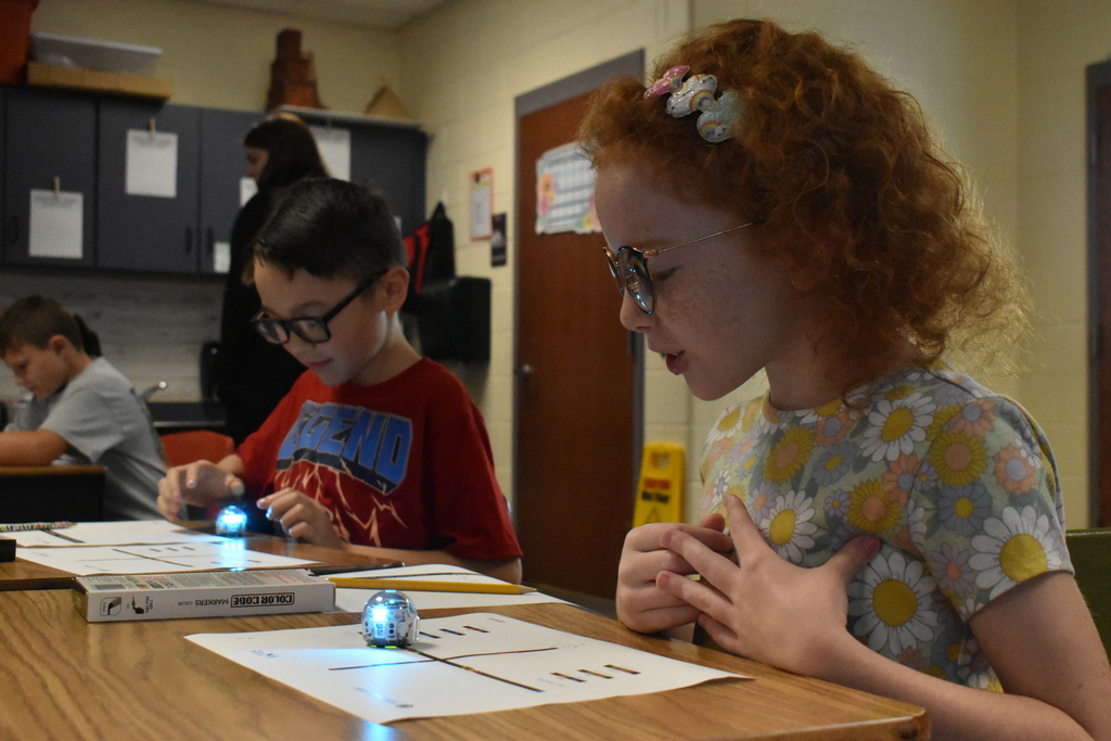 scholars working with ozobots