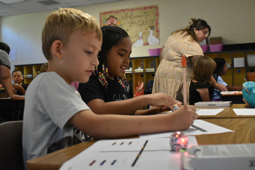 scholars working with ozobots
