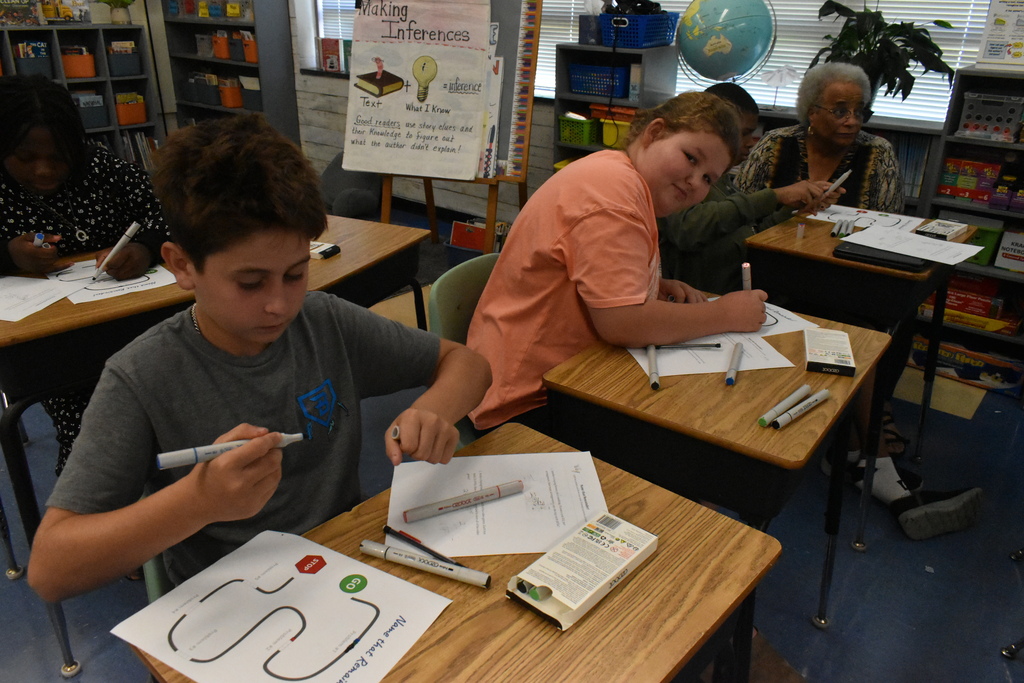 scholars doing division with ozobots