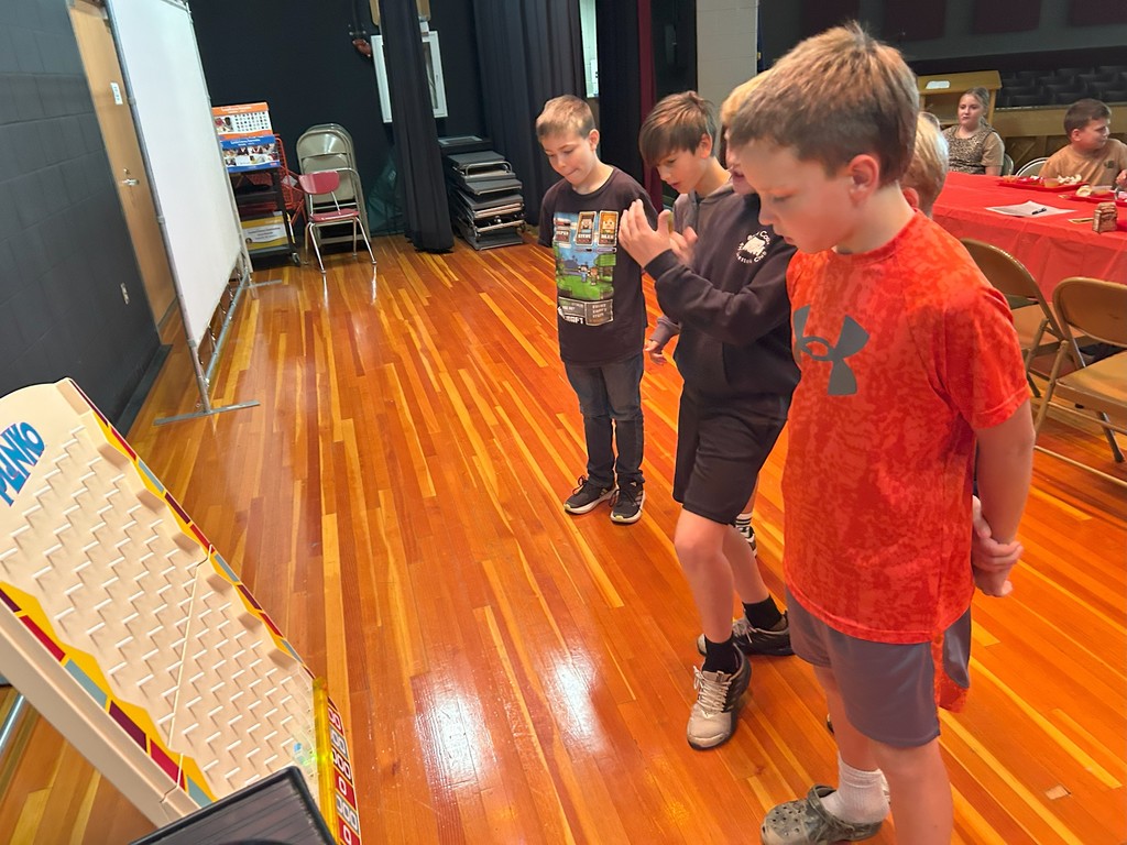 students playing plinko at student of the month lunch