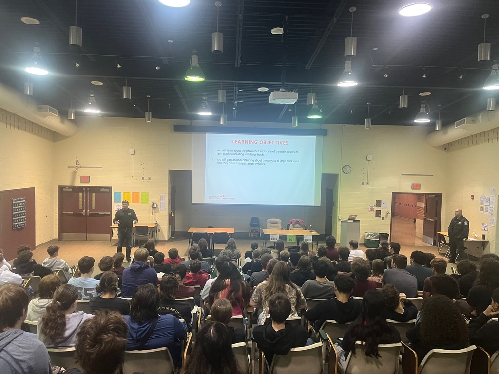 Students listen to safe driving presentation