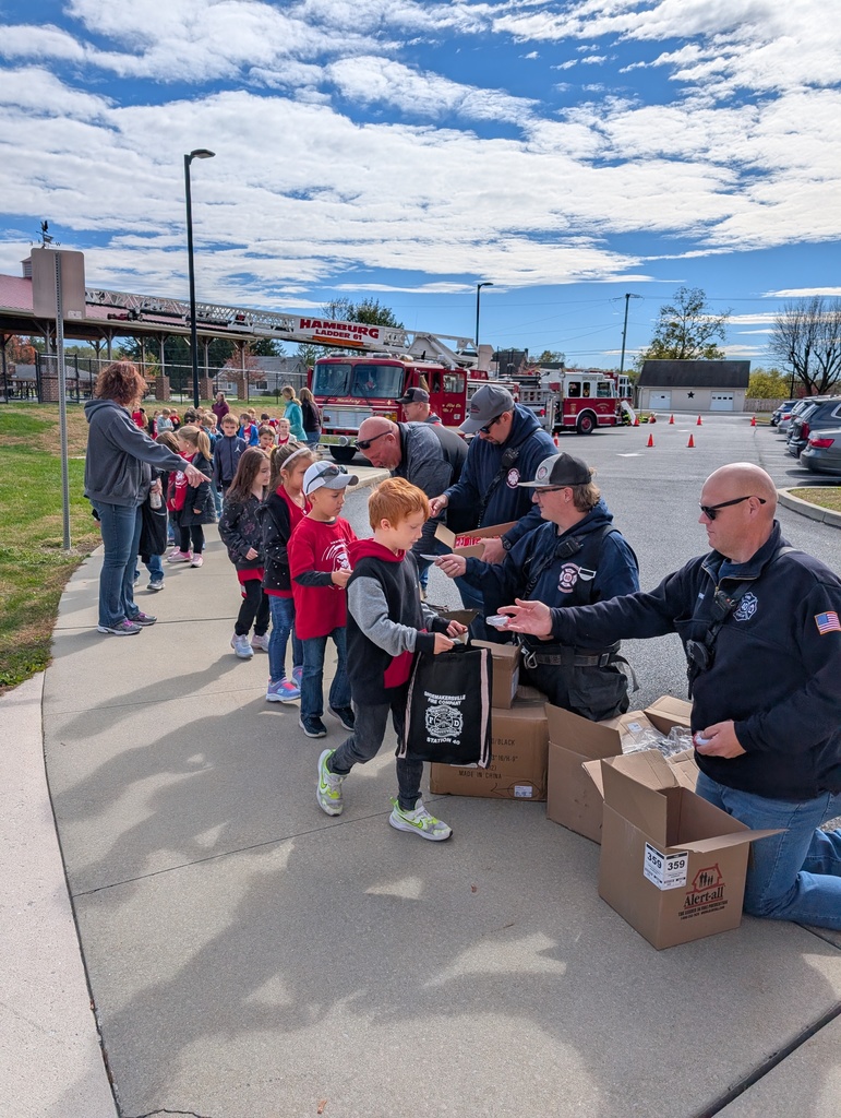 students filling bag with fire prevention items