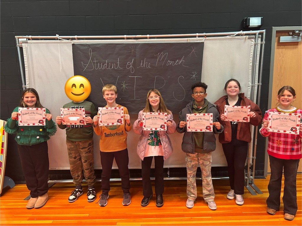 december students of the month holding certificate 